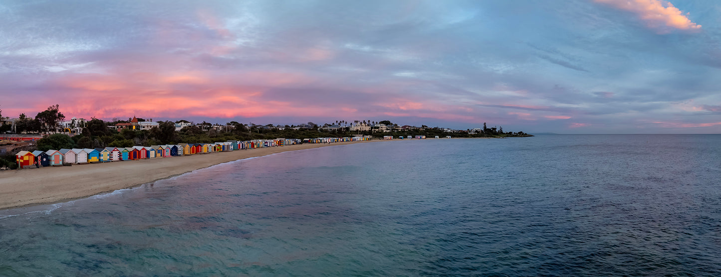 Brighton beach boxes sunset panorama