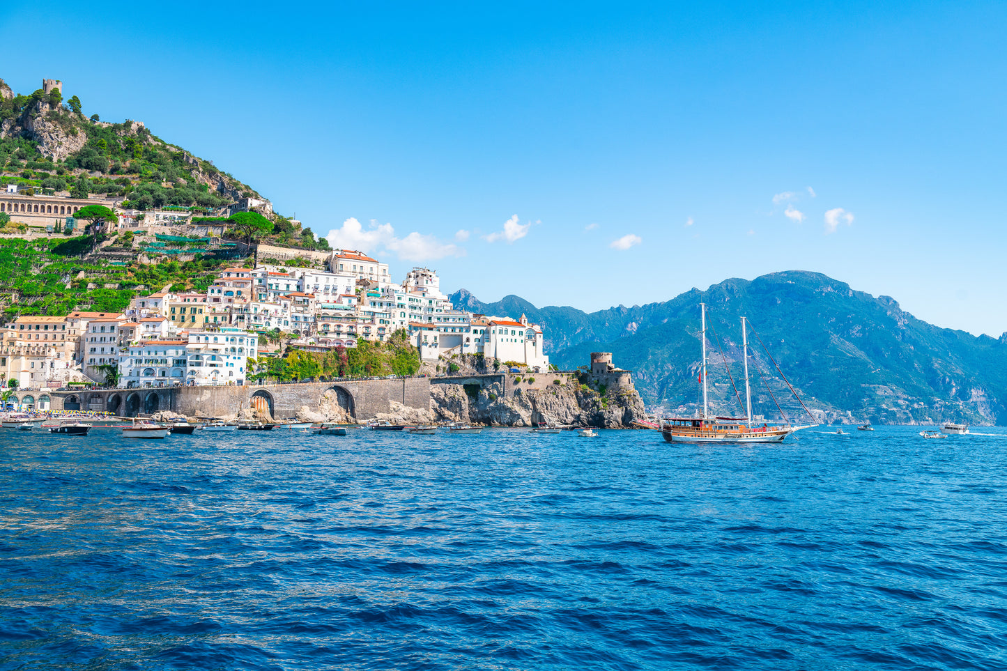 Amalfi coast cliffside houses and yacht Italy