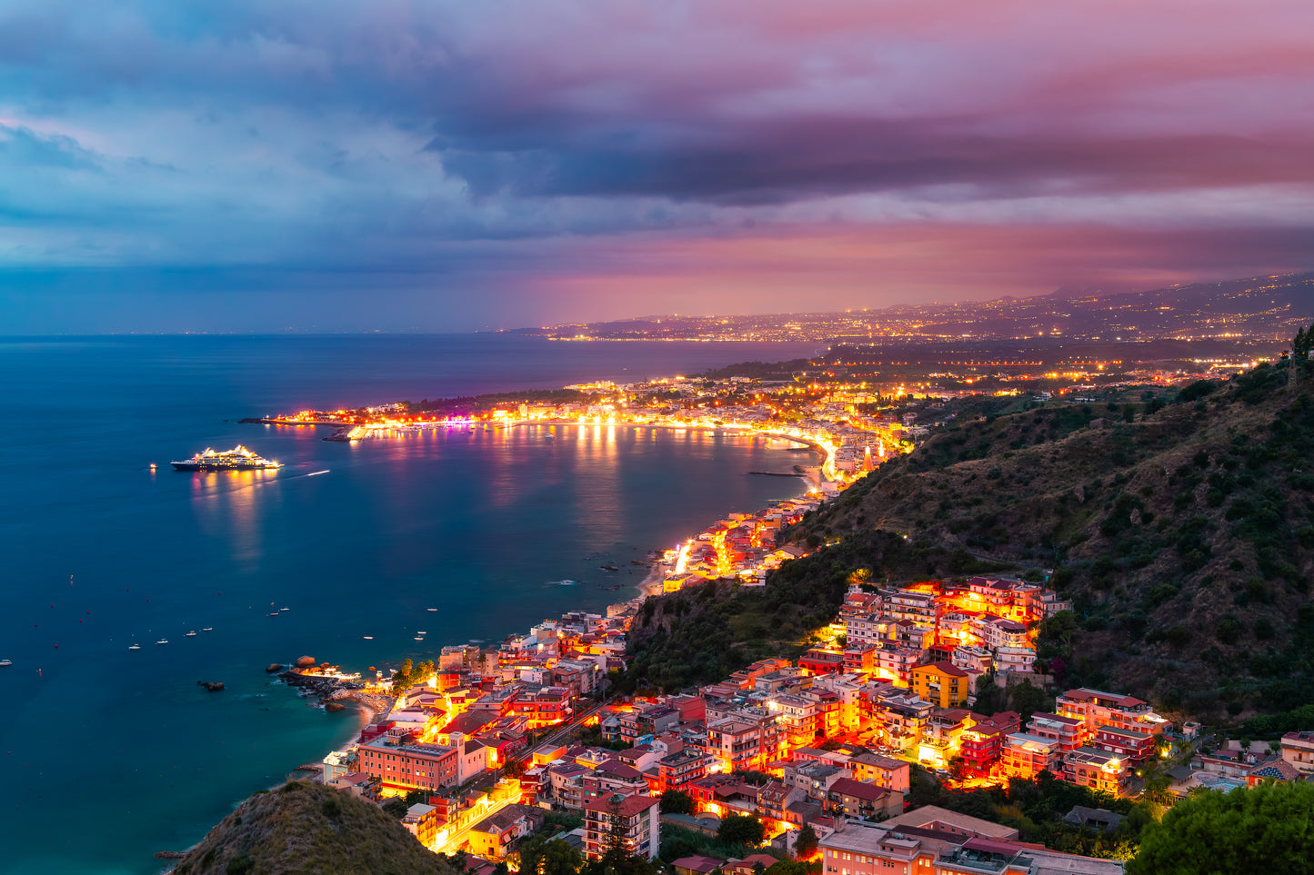 Taormina Sicily blue hour lights Italy