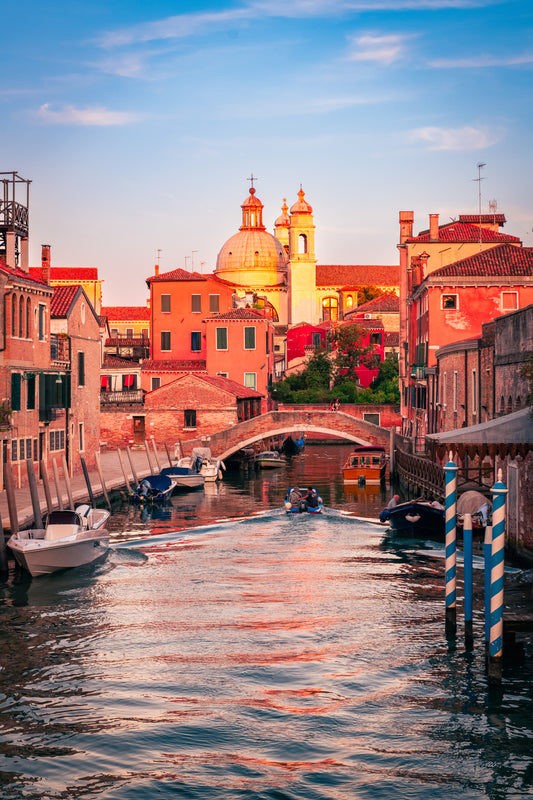 Venice canal locals bridge golden hour Italy